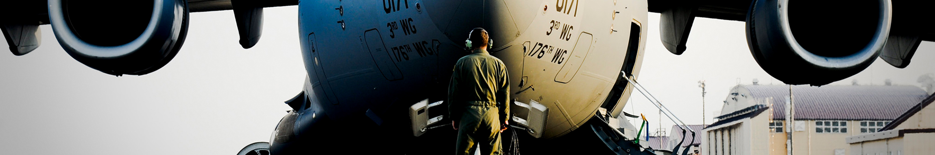 person in front of airplane