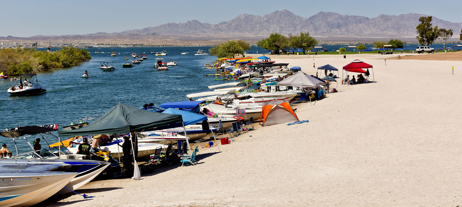 Boats parked on beach on Lake Havasu