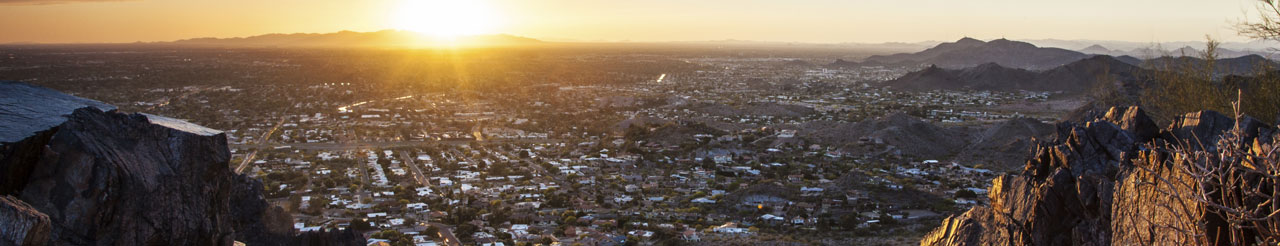 looking at city from on top of a mountain