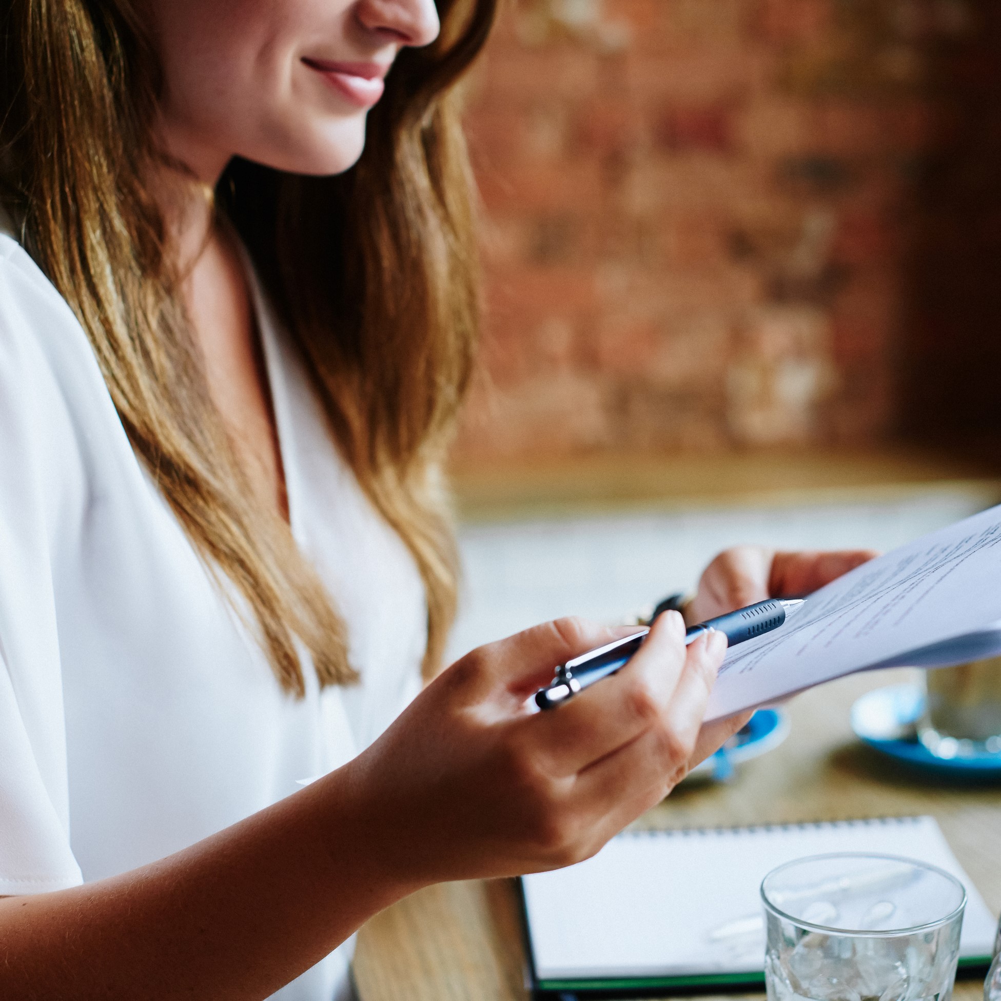 Person with pen and paper