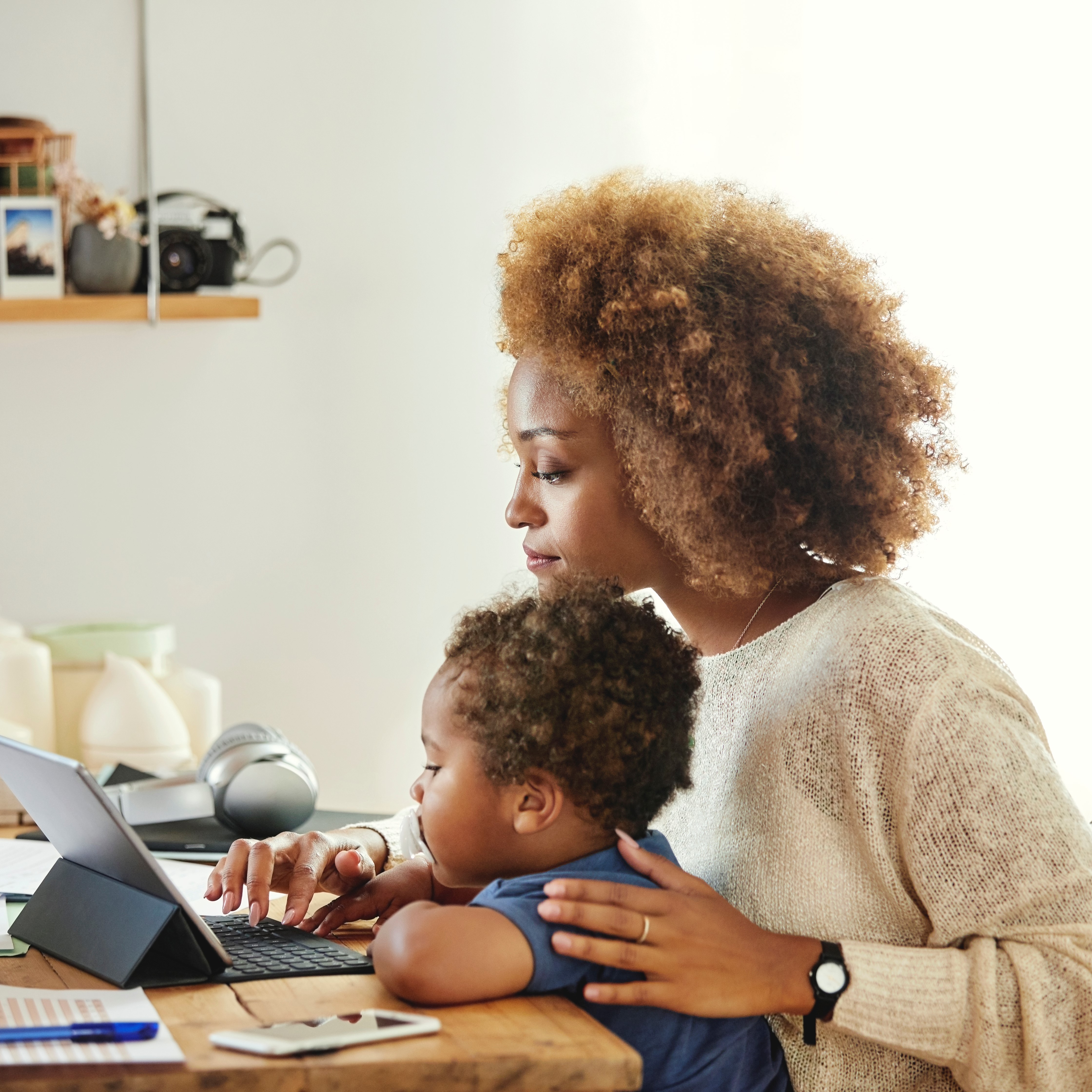 Person with child on tablet