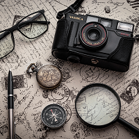 camera, map, compass