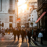 Crowd of people walking on street
