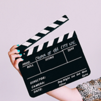 hand with clapboard