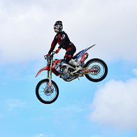 Person on motorcycle performing stunts