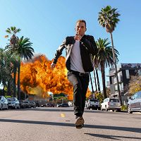 Man running from explosion